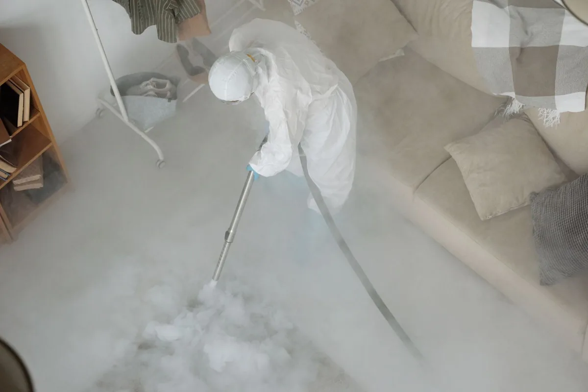Biohazard cleanup technician in protective equipment, Mango, FL